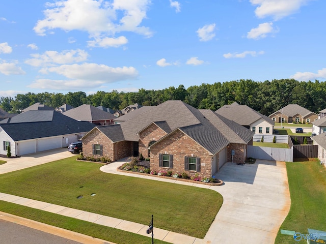 view of front of house featuring a front yard and a garage