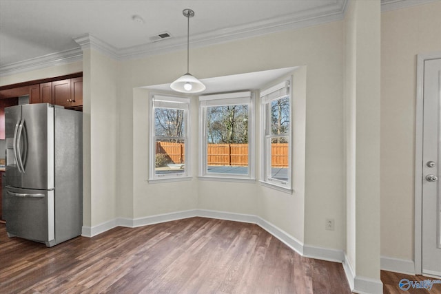 kitchen with dark hardwood / wood-style floors, stainless steel fridge with ice dispenser, pendant lighting, and ornamental molding