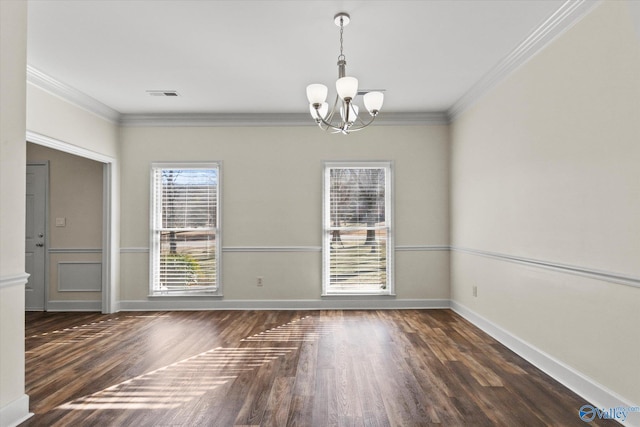 interior space with dark wood-type flooring, plenty of natural light, crown molding, and a notable chandelier