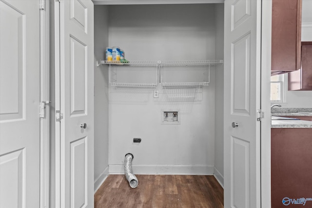 laundry room with washer hookup, electric dryer hookup, and dark hardwood / wood-style floors