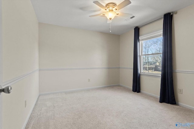 carpeted empty room with ceiling fan