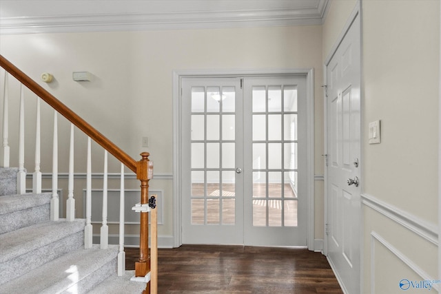 doorway to outside featuring ornamental molding, dark hardwood / wood-style flooring, and french doors