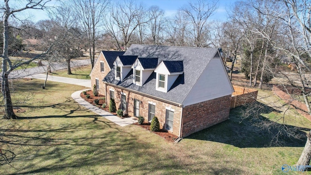 view of side of property with a yard