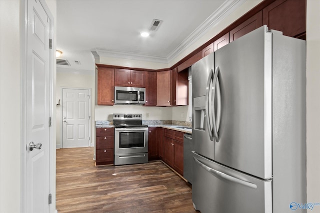 kitchen featuring ornamental molding, dark hardwood / wood-style floors, and appliances with stainless steel finishes