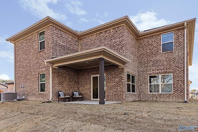 back of house featuring a patio and cooling unit