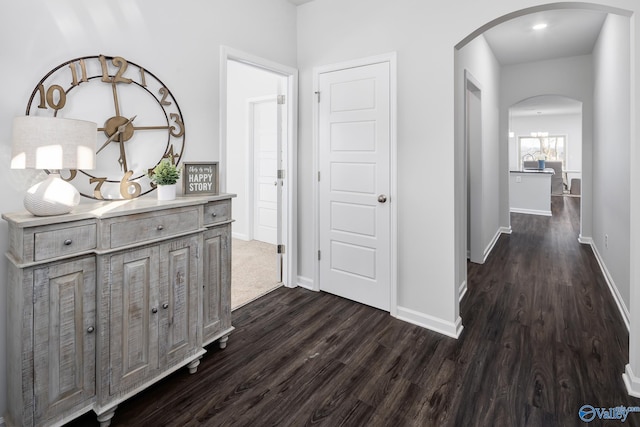 corridor featuring dark wood-type flooring