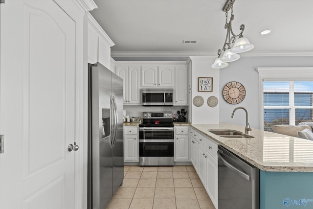 kitchen featuring sink, white cabinetry, light tile patterned floors, pendant lighting, and stainless steel appliances