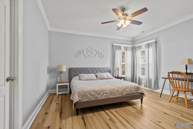 bedroom with crown molding, ceiling fan, and light hardwood / wood-style flooring