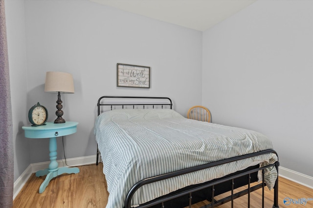 bedroom featuring hardwood / wood-style flooring