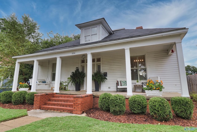 view of front of property featuring covered porch