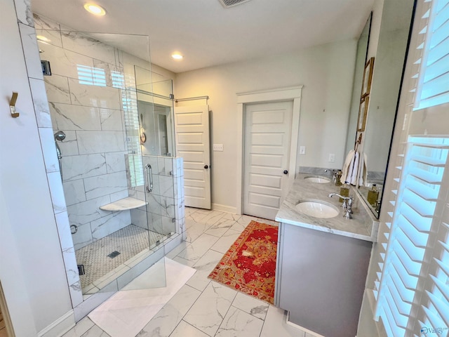 full bath with a sink, a shower stall, recessed lighting, and marble finish floor