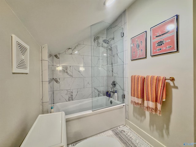 bathroom with shower / bath combination with glass door and lofted ceiling