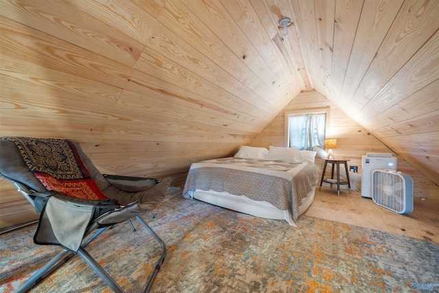 bedroom with wooden walls, vaulted ceiling, and wooden ceiling