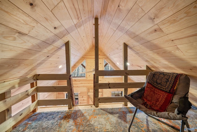 sitting room with lofted ceiling, wooden walls, and wood ceiling