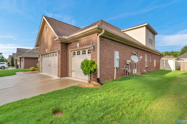 view of side of property with a lawn