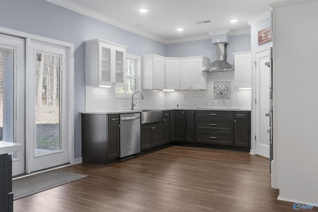 kitchen featuring dark hardwood / wood-style flooring, white cabinetry, dishwasher, and wall chimney exhaust hood