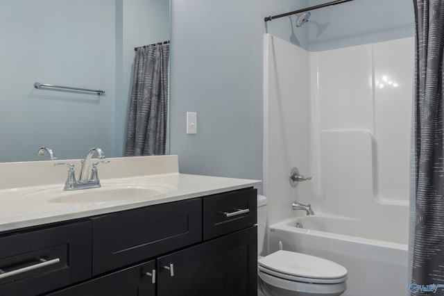 full bathroom featuring vanity, shower / tub combo, and toilet