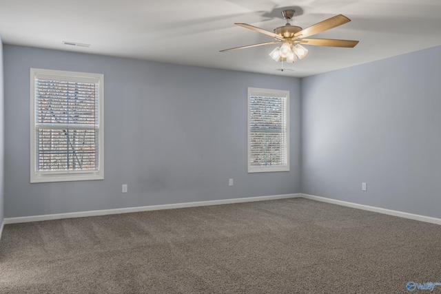 spare room featuring carpet floors and ceiling fan