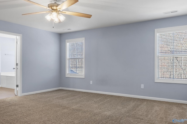 carpeted empty room with ceiling fan