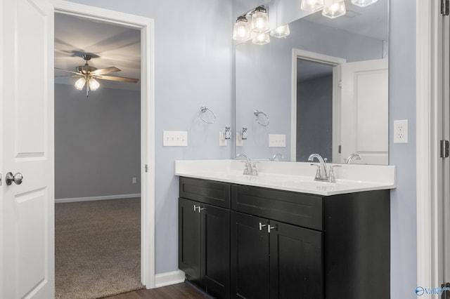 bathroom featuring ceiling fan and vanity