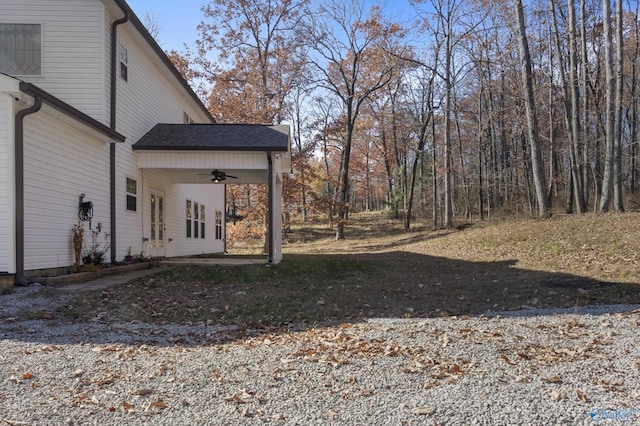 view of yard with ceiling fan