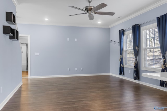 spare room featuring dark hardwood / wood-style floors, ceiling fan, and crown molding