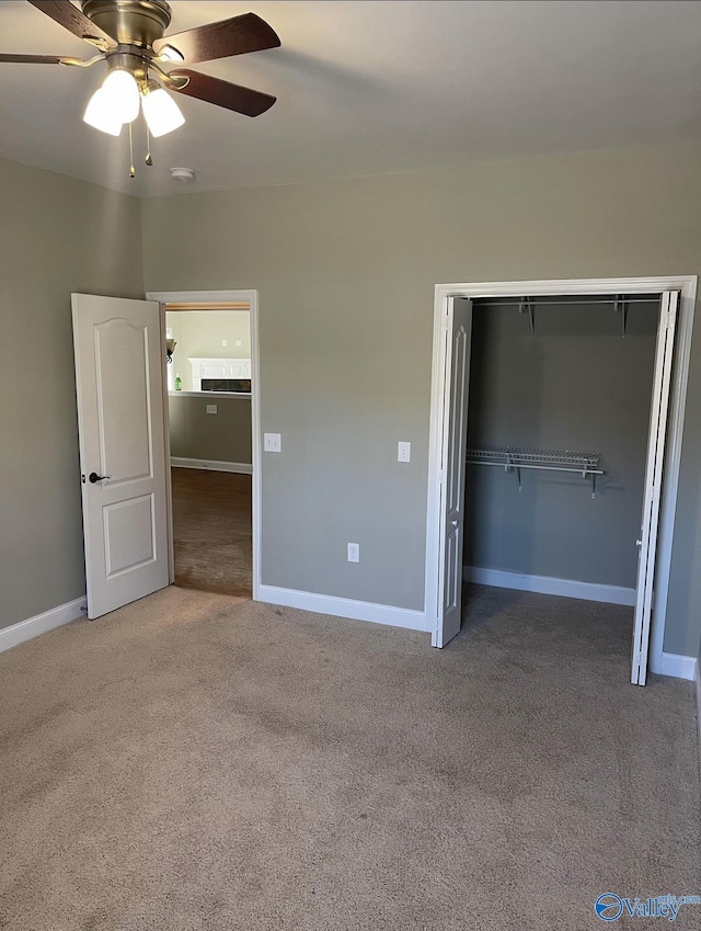 unfurnished bedroom featuring ceiling fan, carpet flooring, and a closet