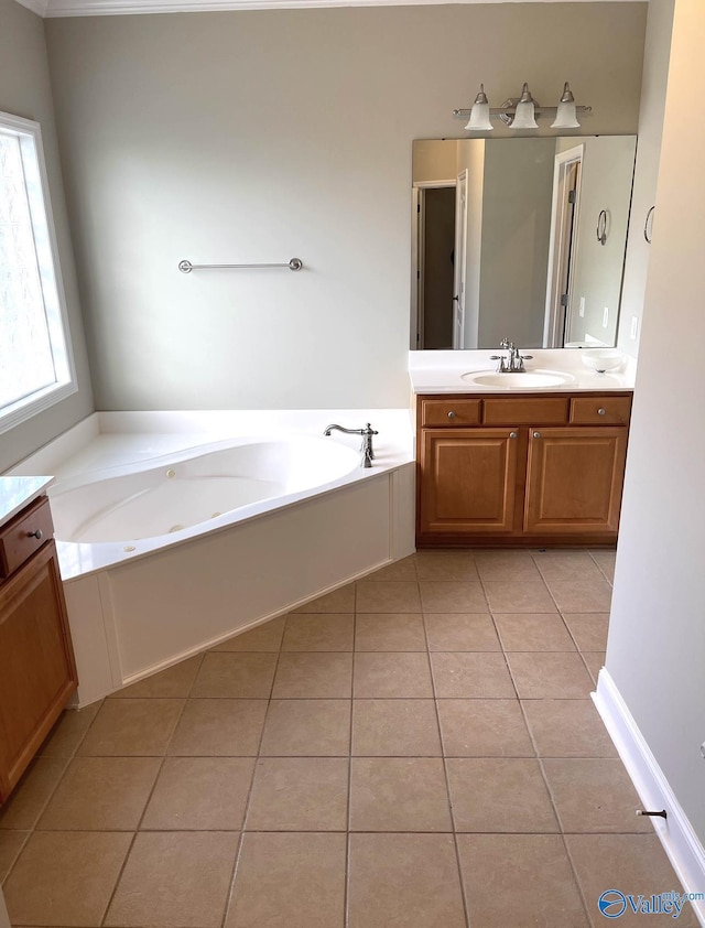 bathroom featuring vanity, tile patterned flooring, and a bathtub