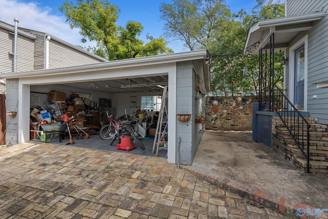 view of patio featuring a garage