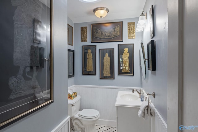 bathroom with toilet and vanity