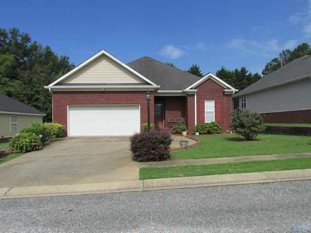 view of front of property with a garage and a front yard