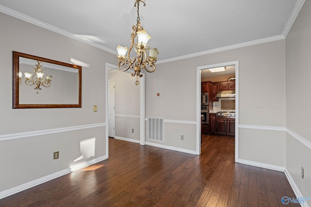 unfurnished dining area with dark hardwood / wood-style flooring, ornamental molding, and a notable chandelier