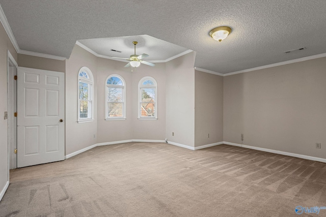 unfurnished room with a textured ceiling, crown molding, and light carpet