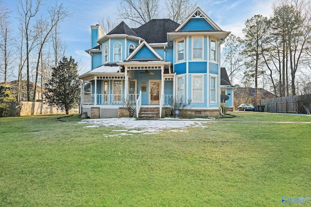 view of front of house featuring a porch and a front yard