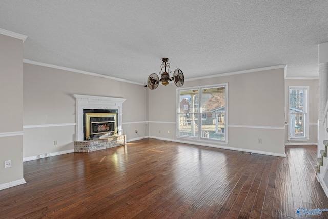 unfurnished living room with a healthy amount of sunlight, crown molding, and an inviting chandelier