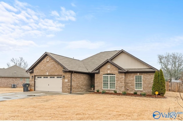 ranch-style home with fence, driveway, roof with shingles, a garage, and brick siding