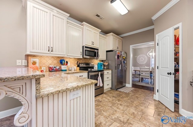 kitchen with decorative backsplash, crown molding, visible vents, and stainless steel appliances