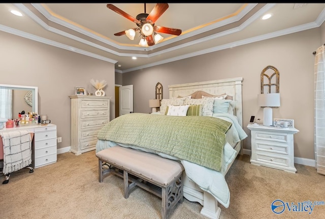 bedroom with carpet flooring, a raised ceiling, and ornamental molding