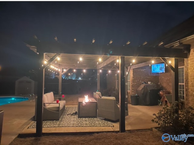 view of patio with area for grilling, a pergola, an outdoor fire pit, a storage shed, and an outdoor structure