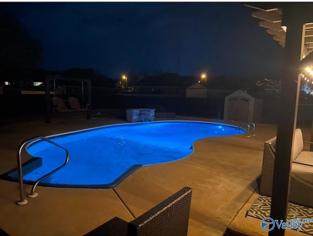 pool at twilight featuring an outdoor pool, an outdoor structure, a storage shed, and a patio