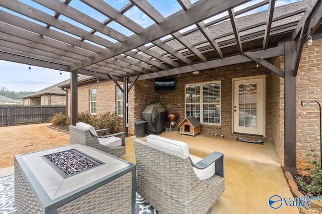 view of patio / terrace featuring fence, a grill, a pergola, and an outdoor fire pit