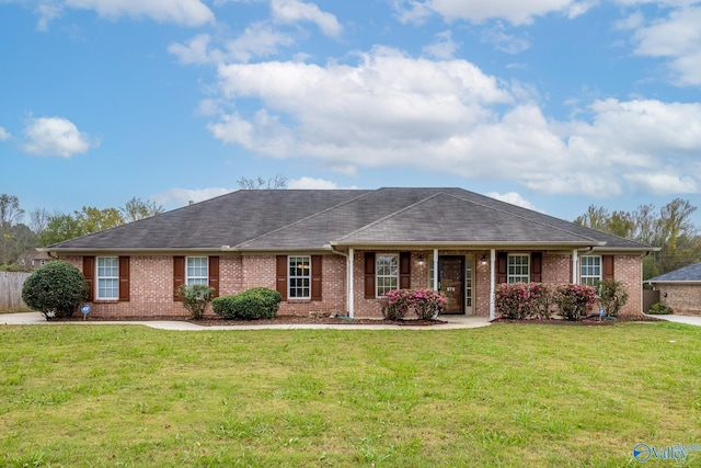 ranch-style home featuring a front yard