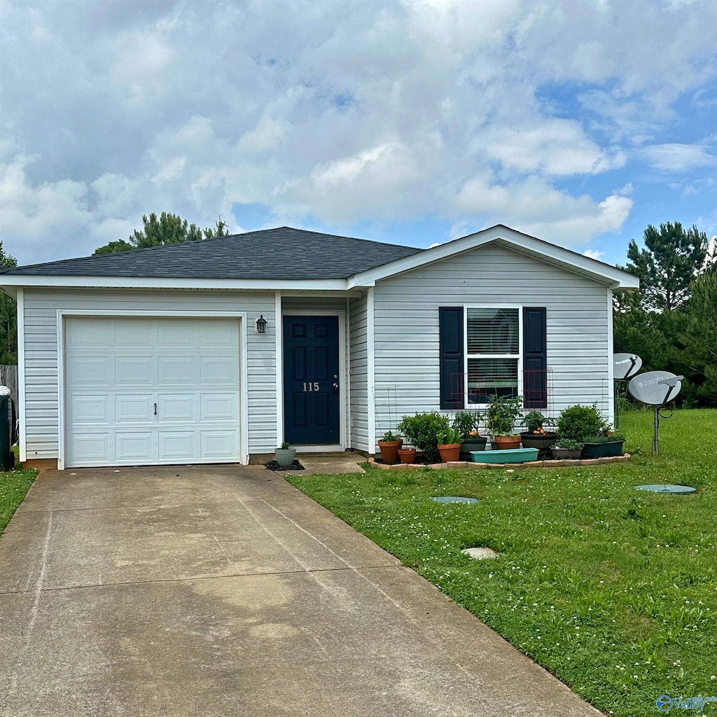 single story home featuring a front lawn, concrete driveway, and a garage