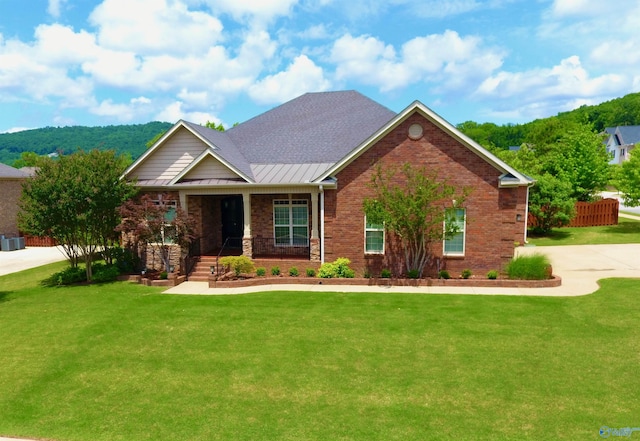 6901 Ridge Pointe Dr SE, Owens Cross Roads, AL 35763 - craftsman inspired home with a standing seam roof, a porch, brick siding, and metal roof