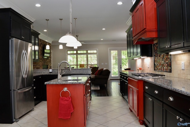 6901 Ridge Pointe Dr SE, Owens Cross Roads, AL 35763 - kitchen featuring stainless steel appliances, a sink, ornamental molding, dark stone counters, and decorative backsplash