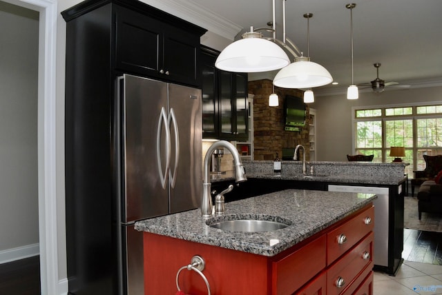 6901 Ridge Pointe Dr SE, Owens Cross Roads, AL 35763 - kitchen with a sink, ornamental molding, stainless steel appliances, a center island with sink, and ceiling fan