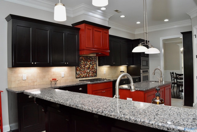 6901 Ridge Pointe Dr SE, Owens Cross Roads, AL 35763 - kitchen with a kitchen island with sink, light stone countertops, stainless steel appliances, tasteful backsplash, and ornamental molding