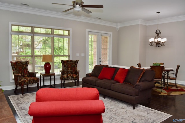 6901 Ridge Pointe Dr SE, Owens Cross Roads, AL 35763 - living room featuring a chandelier, a ceiling fan, baseboards, ornamental molding, and wood finished floors