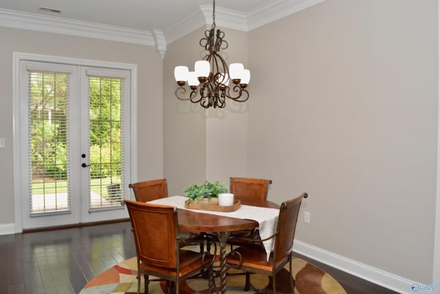 6901 Ridge Pointe Dr SE, Owens Cross Roads, AL 35763 - dining room featuring baseboards, french doors, crown molding, dark wood-type flooring, and a chandelier