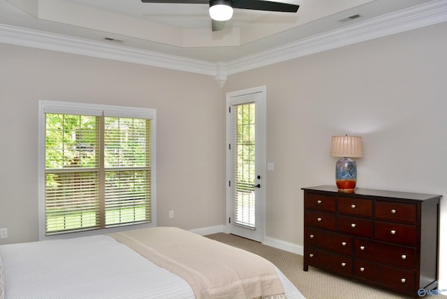 6901 Ridge Pointe Dr SE, Owens Cross Roads, AL 35763 - bedroom featuring light colored carpet, multiple windows, crown molding, and access to exterior